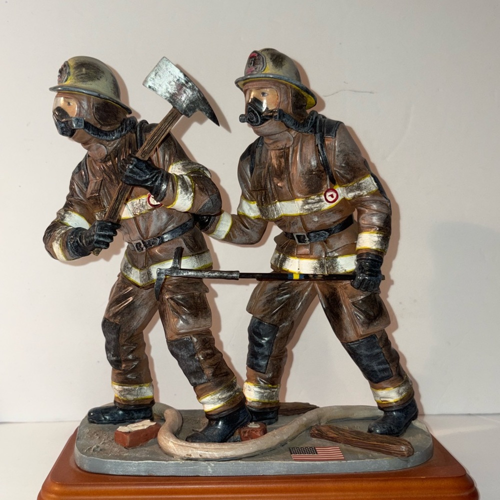Firefighter Sculpture with Axe and Hose